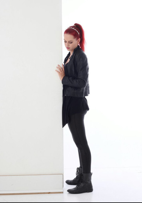 Black dress girl standing pose with wall and floor free png
