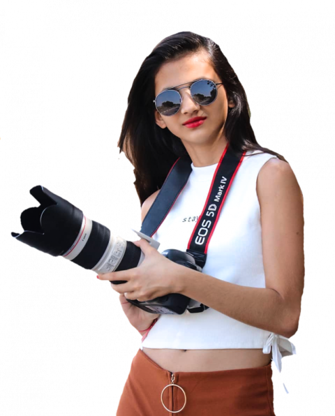 Beautiful girl with camera in white shirt